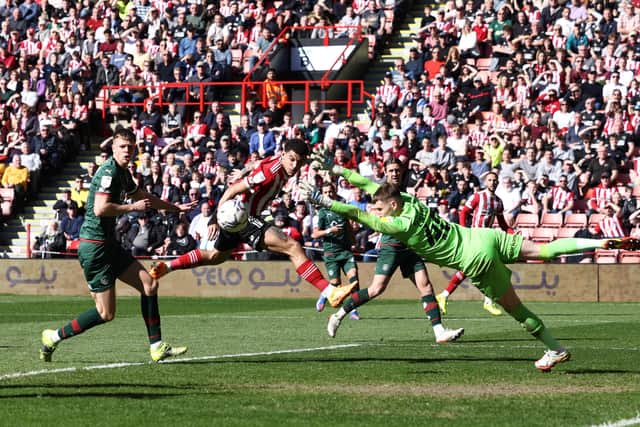 Blades' Morgan Gibbs-White forces a save from Bradley Collins of Barnsley. Picture: Darren Staples / Sportimage