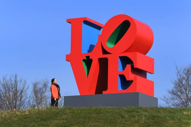 Gemma Donovan with LOVE (Red Blue Green), 1966–1998 by Robert Indiana at the Yorkshire Sculpture Park
Picture Simon Hulme