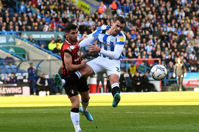 Huddersfield Town's Harry Toffolo takes on Bournemouth's Lewis Cook.
 (Picture: Jonathan Gawthorpe)