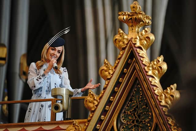 Katherine Jenkins is pictured singing during a service of thanksgiving for Dame Vera Lynn at Westminster Abbey in London. Ms Jenkins closed the service by giving an emotional rendition of We’ll Meet Again, which was followed by the National Anthem. (Photo: Yui Mok/PA Wire)