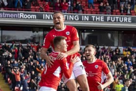 Barnsley leaders: Mads Andersen celebrates scoring against Middlesbrough with Carlton Morris and Michal Helik. (Picture: Tony Johnson)