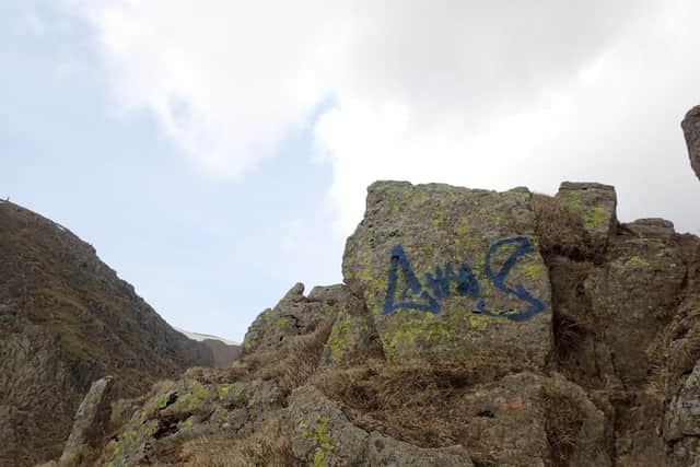 Grafitti on rocks along Striding Edge in the Lake District. (Credit: @LakesWeather/Twitter)