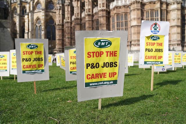 Signs erected near the Houses of Parliament, in Westminster, in protest against the decision by P&O Ferries to sack 800 of its staff.