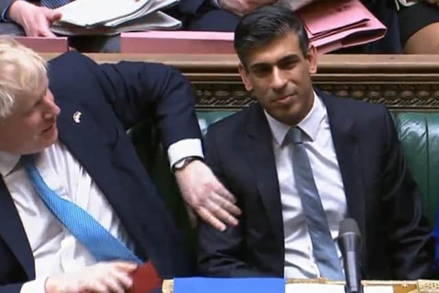 Prime Minister Boris Johnson congratulates Chancellor of the Exchequer Rishi Sunak after he delivered his Spring Statement in the House of Commons, London.