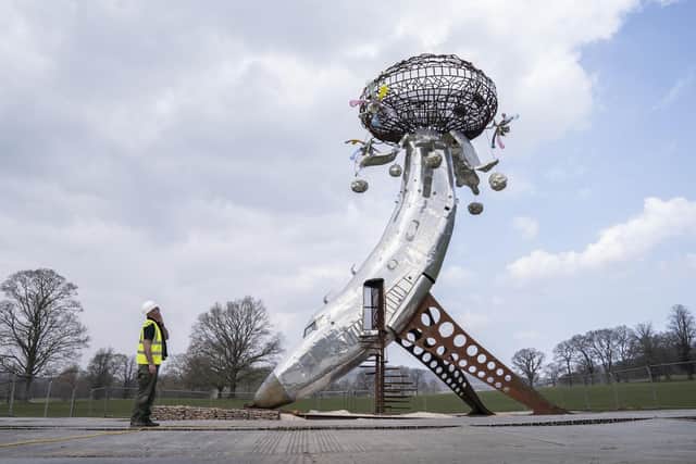 Jonathan Maginn views Lodestar by artist Randy Polumbo, at the UK debut of the Radical Horizons: The Art of Burning Man, large scale artworks at Chatsworth House, Bakewell in Derbyshire. Danny Lawson/PA Wire