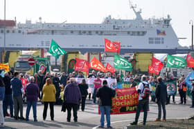 People take part in a demonstration against the dismissal of P&O workers organised by the Rail, Maritime and Transport (RMT) union at the P&O ferry terminal in Cairnryan, Dumfries and Galloway