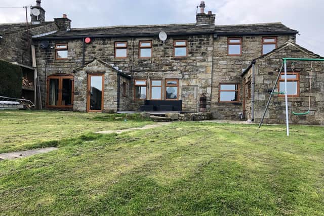 This farmhouse and cattery in Oakworth, near Haworth is for sale with Alan j. Picken
