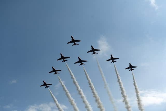 The Red Arrows perform a fly past of RAF Leeming before the ceremony to mark the disbanding of 100 Squadron.