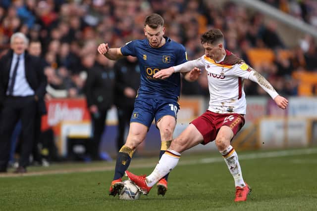 UP FOR IT: Mansfield Town's Rhys Oates and Bradford City's Matty Foulds battle for the ball at Valley Parade last month. Picture: James Williamson/Getty Images