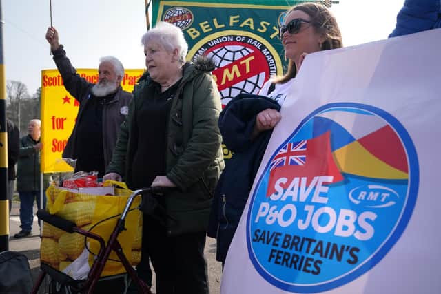 People take part in a demonstration against the dismissal of P&O workers organised by the Rail, Maritime and Transport (RMT) union at the P&O ferry terminal in Cairnryan, Dumfries and Galloway (PA)
