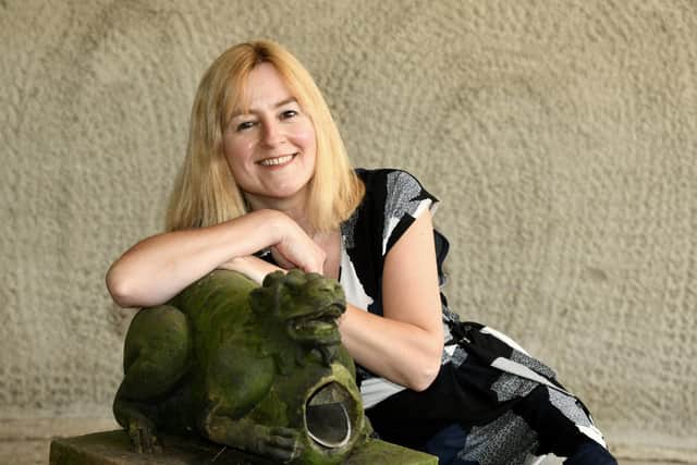 Emma Padgett, a director at Hartleys Auctions Ltd at Ilkley, with a sandstone gargoyle featured in one of its previous auctions.