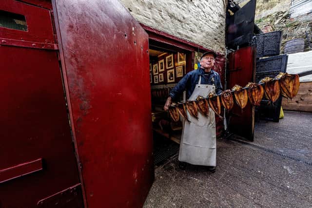 Derek Brown brings finished kippers from the smokehouse and into the shop, tucked away on Henrietta Street.
Picture: Charlotte Graham.