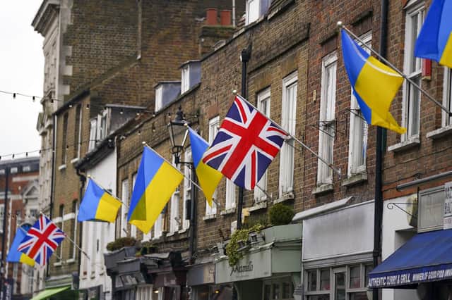 Ukrainian flags are flown from properties in Church Street, Twickenham in southwest London