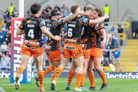 Tigers' celebrate after a try from George Laaler, right. Picture by Allan McKenzie/SWpix.com.