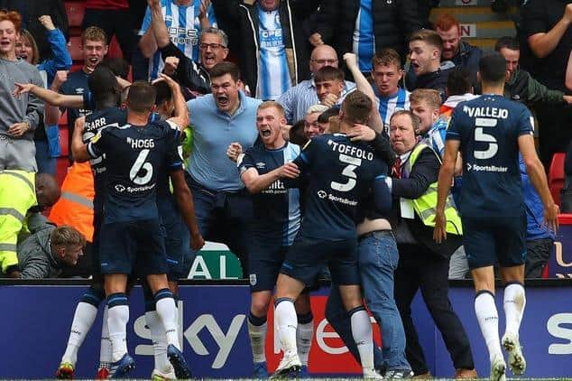 Levi Colwill of Huddersfield Town is mobbed after scoring the winning goal against Sheffield United at Bramall Lane in August. Picture: Simon Bellis / Sportimage