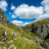 Walkers enjoy the limestone landscape of the dry valley above Malham Cove, which has been one of the most popular destinations in the Yorkshire Dales National Park this year. (Photo: Bruce Rollinson)