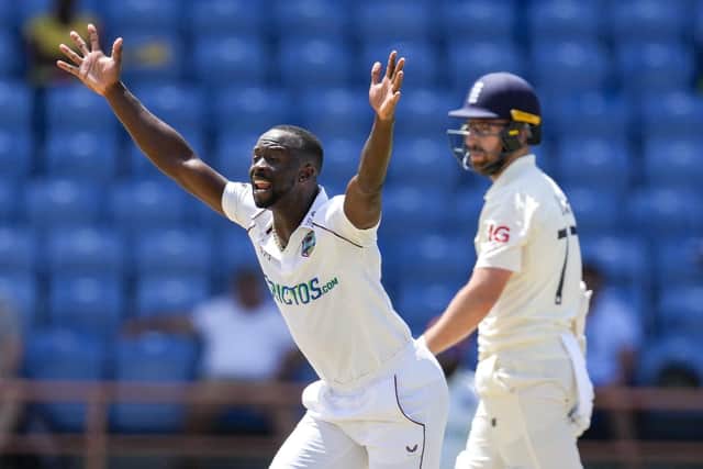 Out: West Indies' Kemar Roach successfully appeals for the wicket of England's Jack Leach. (AP Photo/Ricardo Mazalan)