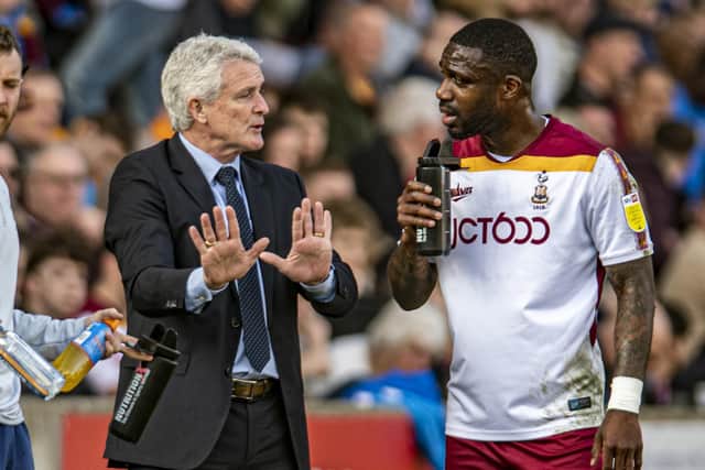 Bantams manager Mark Hughes speaks with Yann Songo'o. Picture: Tony Johnson