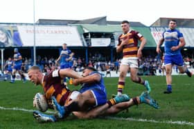 Huddersfield Giants' Jack Ashworth scores a try at Barrow. Picture: PA.