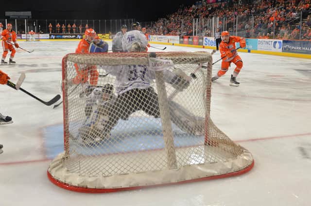 Brandon Whistle (far right) scores the winning goal against Manchester Storm on Sunday night. 
Picture: Dean Woolley/EIHL