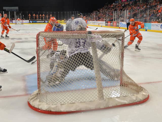 Brandon Whistle (far right) scores the winning goal against Manchester Storm on Sunday night. Picture: Dean Woolley/EIHL