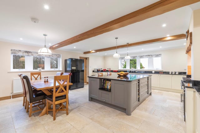 The large, no expense spared kitchen with room for dining is the hub of the house and there is a separate utility room.