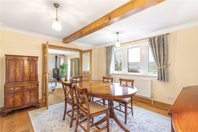The formal dining room with table positioned to make the most of those fabulous views.