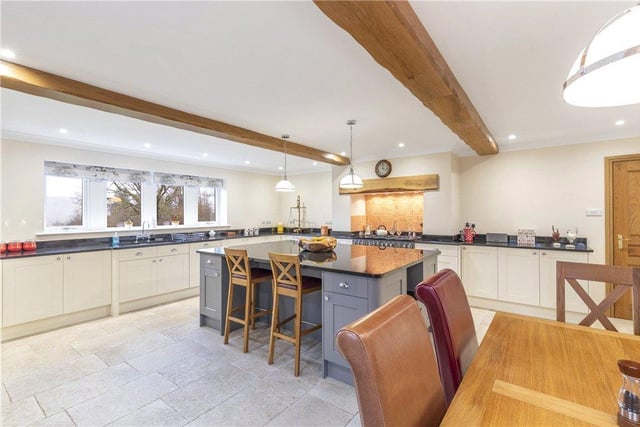 The kitchen with plenty of worktop space and an island  is perfect for keen cooks