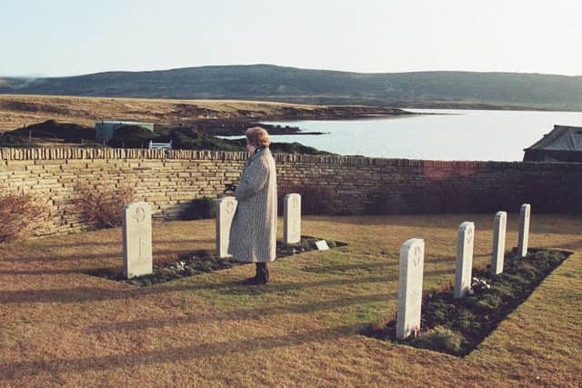 File photo dated 15/06/82 of former British Prime Minister Margaret Thatcher alone at San Carlos cemetery remembering the servicemen who lost their lives at this ground where the invasion started.