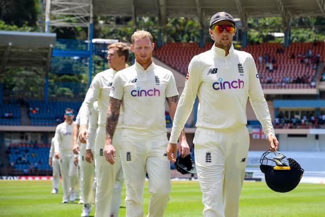 Joe Root and Ben Stokes lead England off the field after defeat to West Indies in Grenada. Picture:  RANDY BROOKS/AFP via Getty Images)