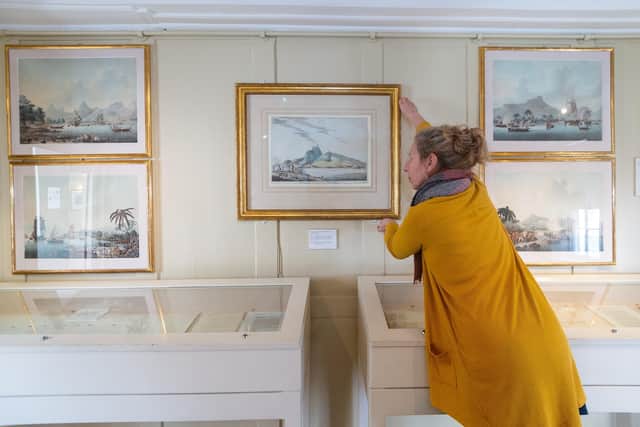 Maria Aparicio, Operation Manager at Captain Cook Memorial Museum, Whitby, next to the acquired watercolour painting that has gone on display for the first time after being gifted from the Estate of the Dowager Marchioness of Normanby.
