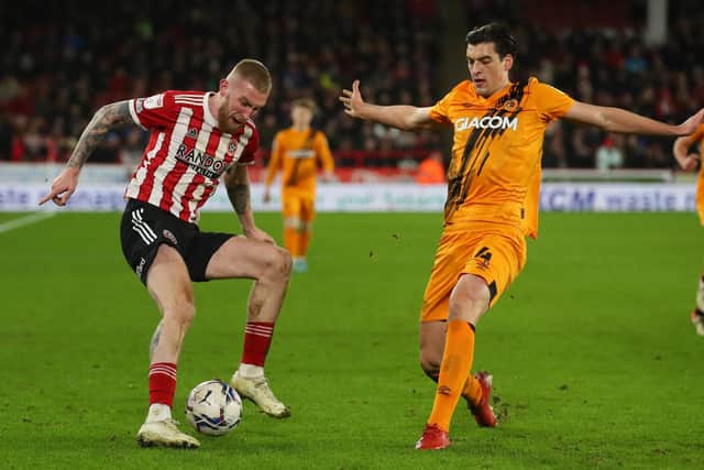 Oli McBurnie of Sheffield Utd is challenged by Jacob Greaves of Hull City during the Sky Bet Championship match at Bramall Lane, Sheffield. (Picture: Simon Bellis / Sportimage)
