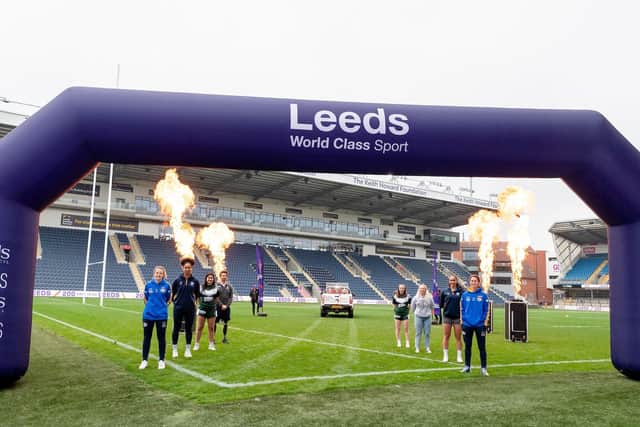 Leeds Women representing Leeds as a Sporting City, including Lois Forsell (left) and Courtney Winfield-Hill (right) stand by as the RLWC Trophies arrive at Headingley Stadium. Picture by Will Palmer/SWpix.com