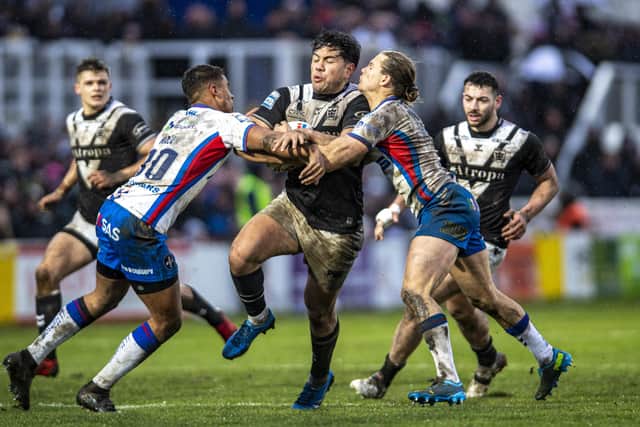 CONSISTENCY: Hull FC's Andre Savelio runs at Wakefield Trinity's Corey Hall and Jacob Miller in the Yorkshire derby back in February. Picture Tony Johnson.