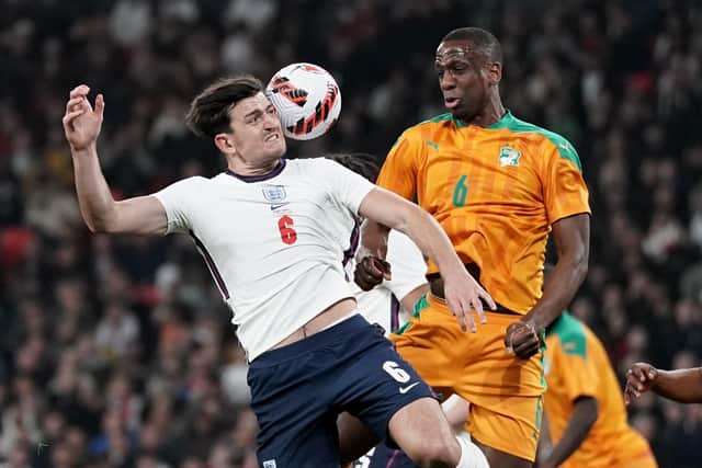 England's Harry Maguire tries to head at goal, under pressure from Ivory Coast's Willy Boly during the international friendly match at Wembley Stadium, London. Picture date: Tuesday March 29, 2022. PA Photo. See PA story SOCCER England. Photo credit should read: Nick Potts/PA Wire.

RESTRICTIONS: Use subject to FA restrictions. Editorial use only. Commercial use only with prior written consent of the FA. No editing except cropping.