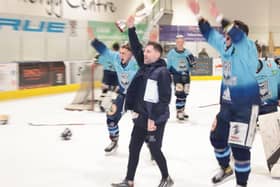 CHAMPIONS: Sheffield Steeldogs' head coach Greg Wood holds the NIHL National Cup aloft after beating Telford Tigers over two legs. Picture: Peter Best.