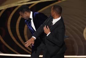 Will Smith hit Chris Rock on stage while presenting the award for best documentary feature at the 2022 Oscars