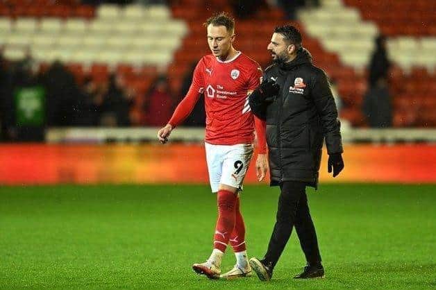 Barnsley FC captain Cauley Woodrow, pictured with head coach Poya Asbaghi. Picture: Bruce Rollinson.