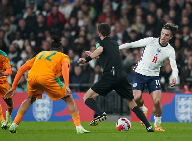 England's Jack Grealish (right) evades referee Erik Lambrechts during the international friendly against Ivory Coast at Wembley Picture: Nick Potts/PA
