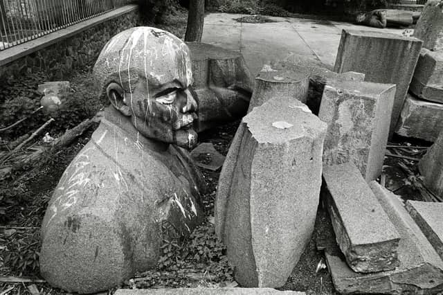 Tim Smith's picture of a statue of Lenin which used to dominate the main square in Kyiv, then called the Square of the October Revolution, lying dismantled in a car park behind the capitals history museum. It was surrounded by the statues of other Soviet figureheads removed during 1991.