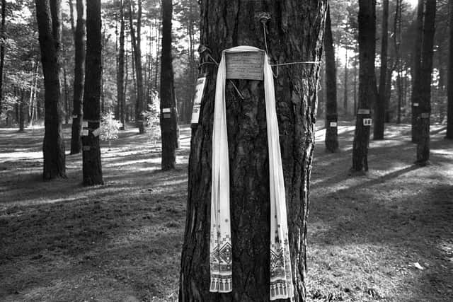 Tributes in the Bykivnia forest on the outskirts of Kyiv, which served as a vast burial ground for the NKVD and KGB. It is estimated that about 200,000 victims of the Soviet system, mainly those shot in Kyiv, are buried there. Picture: Tim Smith.