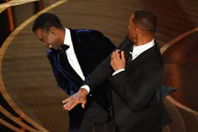 Will Smith (R) slaps Chris Rock onstage during the 94th Oscars at the Dolby Theatre in Hollywood. Photo by ROBYN BECK/AFP via Getty Images