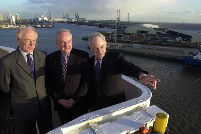 Library image of the Former Master of the Norland during the Falklands conflict, Capt Don Ellerby, right, on the wing of the bridge before the final sailing from Hull in 2002, with Bob Lough, centre, Chief Officer at the time, and Capt Chris Esplin-Jones, senior naval officer. Picture: JPI Media