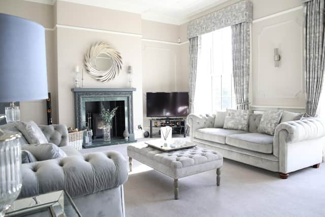Charlotte chose grey, upholstered chesterfields for the sitting area and hired Claire Williamson of From Fabric to Finished Interiors in nearby Burton Salmon  to make bespoke curtains and blinds, as the windows are a variety of shapes and sizes.