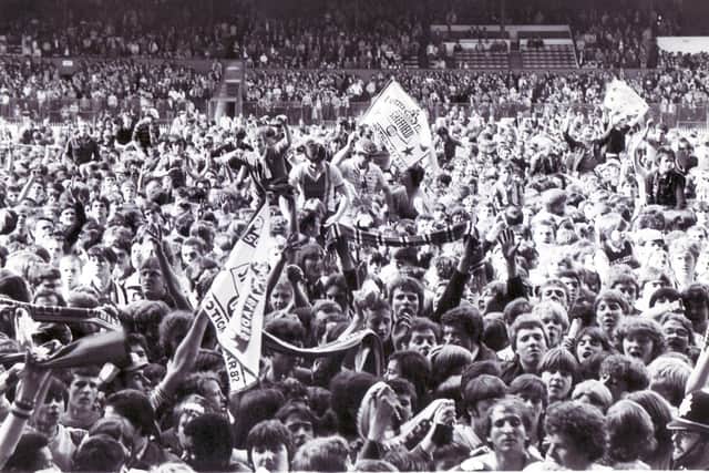 Sheffield United's jubilant fans invade the pitch after the win over Peterborough on 8th May 1982