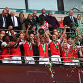 CHAMPIONS: Rotherham United captain Richard Wood lifts the Football League Trophy after a very hard-fought final