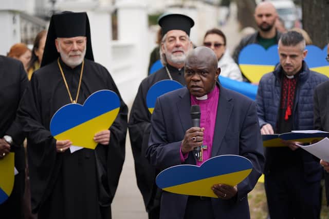 Chair of Christian Aid and former Archbishop of York, John Sentamu, joins other church leaders leading a crowd in an act of witness outside the Ukrainian embassy in Holland Park, west London