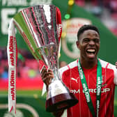 Winning smile: Rotherham United's Chiedozie Ogbene lifts the trophy following the Papa John's Trophy final win over Sutton United at Wembley. Picture: Zac Goodwin/PA Wire.