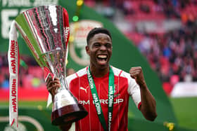 Winning smile: Rotherham United's Chiedozie Ogbene lifts the trophy following the Papa John's Trophy final win over Sutton United at Wembley. Picture: Zac Goodwin/PA Wire.