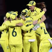 Australian players celebrate defeating England in the final of the ICC Women's Cricket World Cup match in Christchurch, New Zealand (Martin Hunter/Photosport via AP)